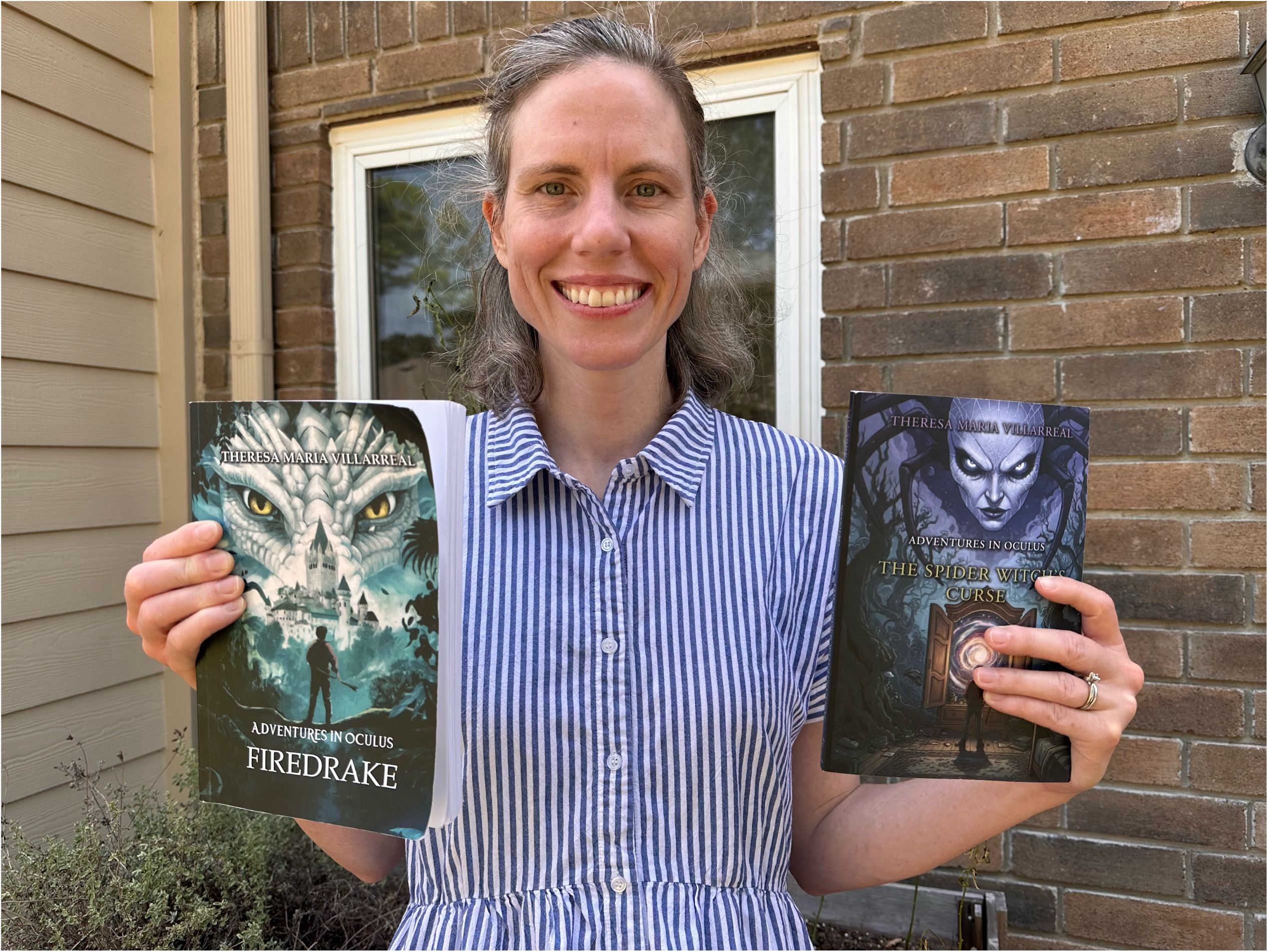 Theresa Maria Villarreal holding her two Adventures in Oculus books